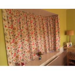 Bold geometric design used for updating Ercol chair covers and matching cushion.jpg