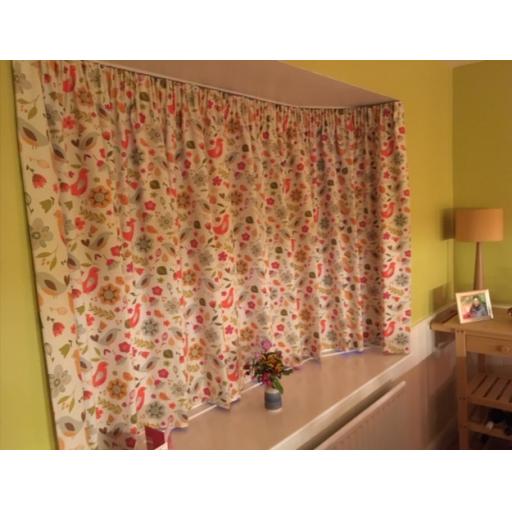 Bold geometric design used for updating Ercol chair covers and matching cushion.jpg