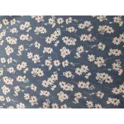 Floral denim with white flower on mid blue denim background. Ideal for dressmaking