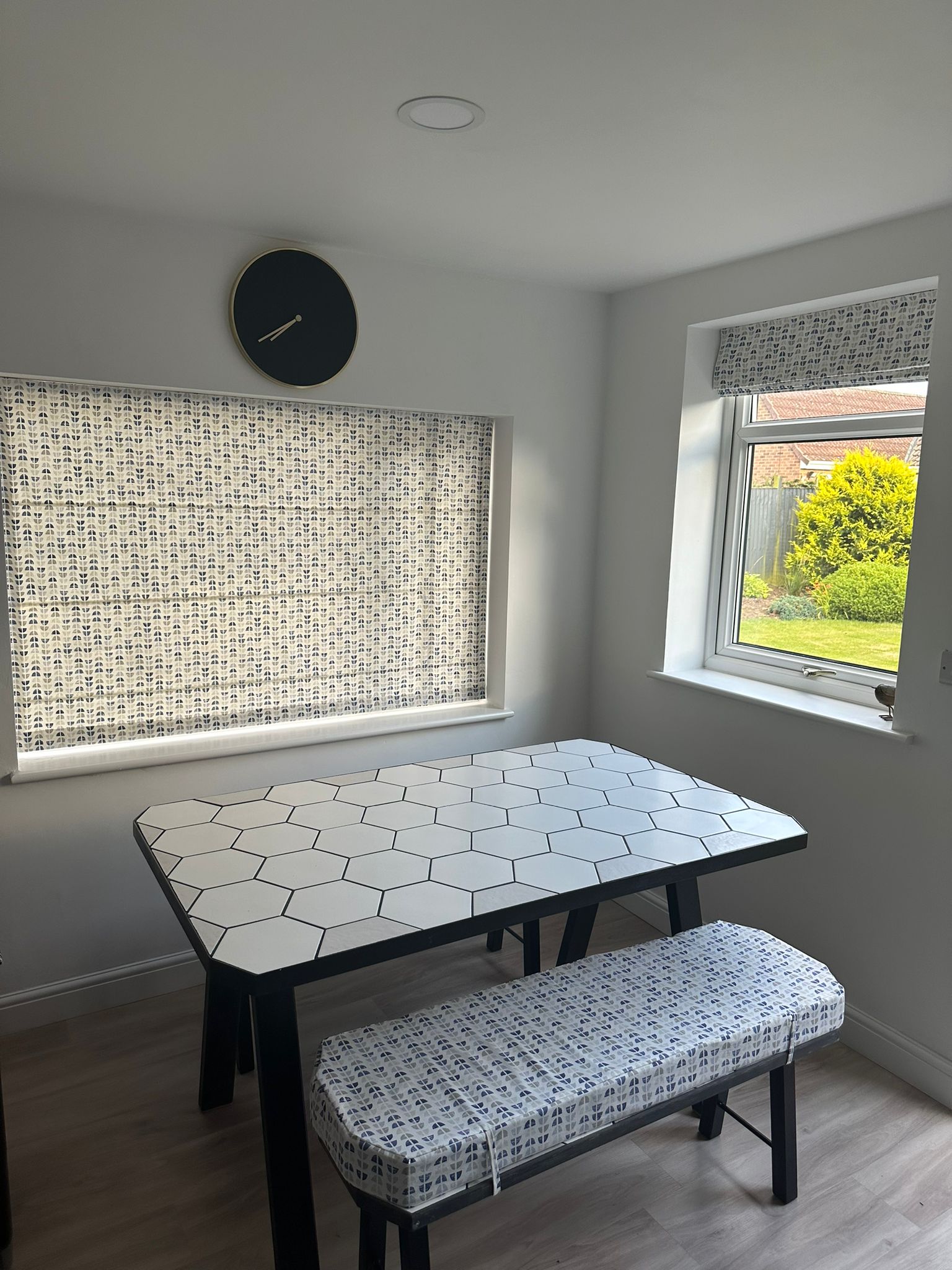 White and blue geometric roman blind and seat pads.jpg