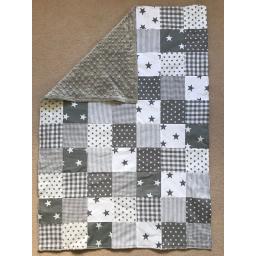 Neutral greys quilt with large and small stars, checks and plains with grey dimple fleece backing