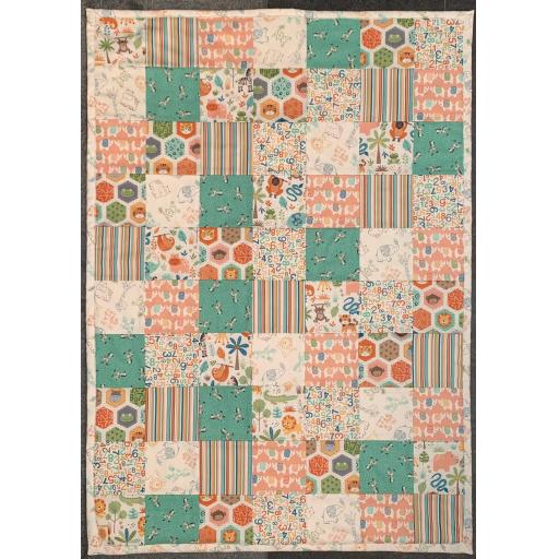 Neutral coloured patterened baby quilt